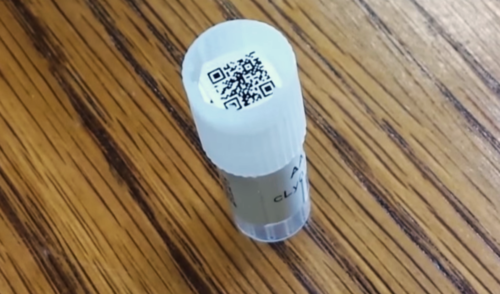 Photo showing a 2D barcode on top of lab vial