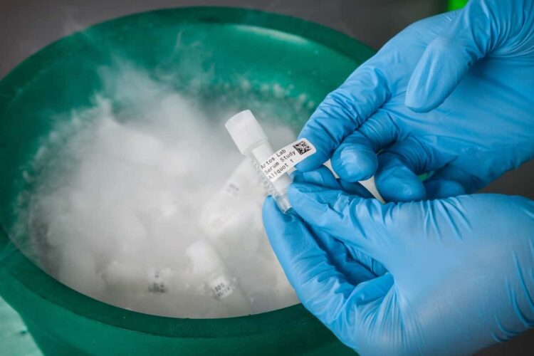 Labeled vial is placed into a vat of liquid nitrogen.